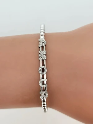 0.23ct Diamond & 18ct White Gold "Amour" Ball Bangle 7.9g